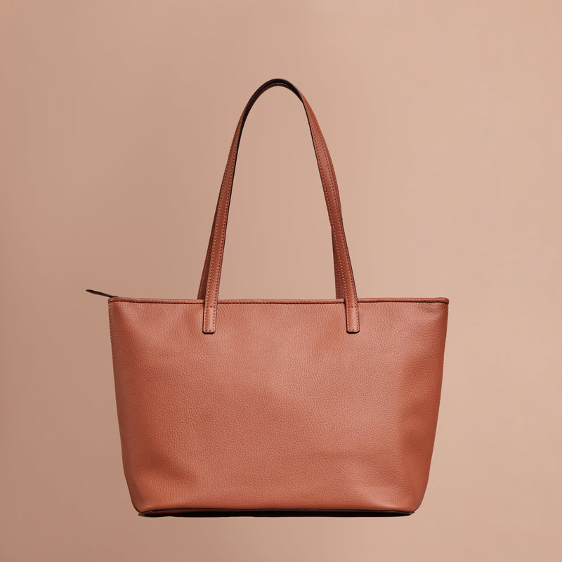 Tan handcrafted full grain leather  tote bag with YKK zipper and internal leather lining. 