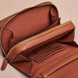 Tan Crossbody Handcrafter Full grain leather wallet with zipper.